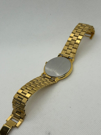 Seiko dress watch quartz gold watch with black dial and date function, with box