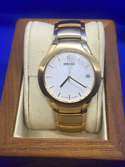 Seiko sports gold bracelet and dial with date function