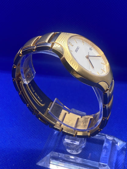 Seiko sports gold bracelet and dial with date function