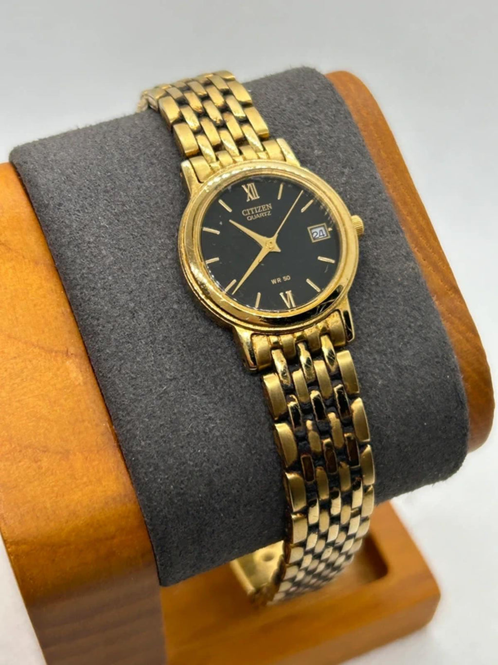 Ladies Citizen gold quartz detach with black dial dress watch