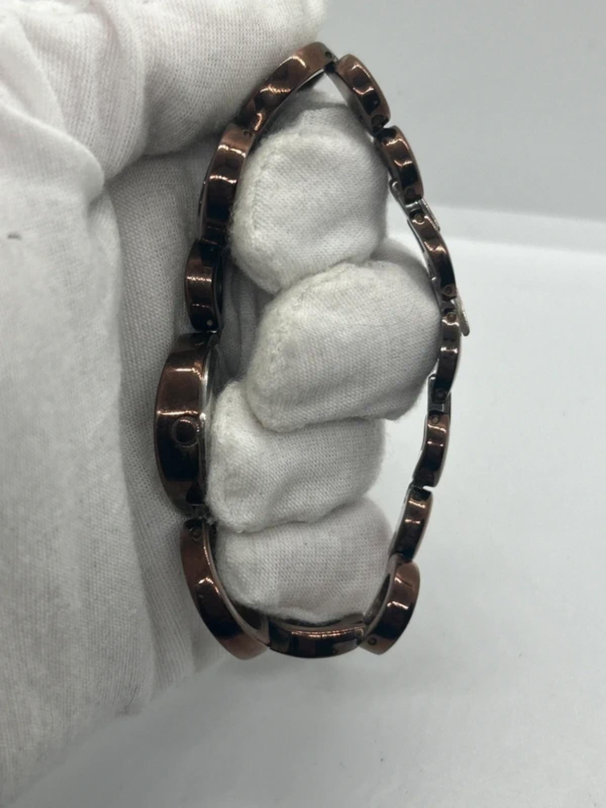 Ladies Fossil bronze bracelet watch waved dial