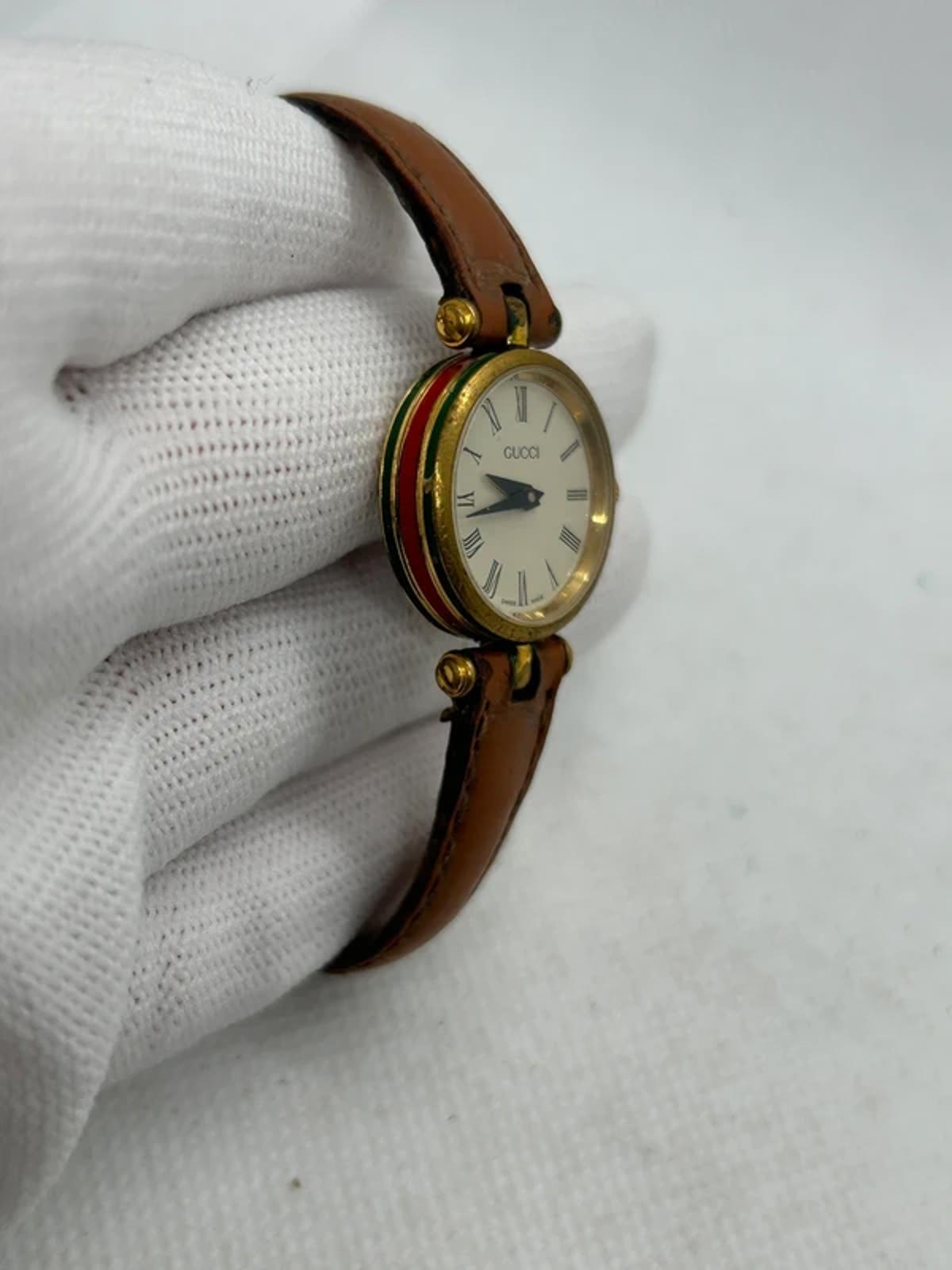 Vintage Gucci ladies watch with gold dial and red green case watch