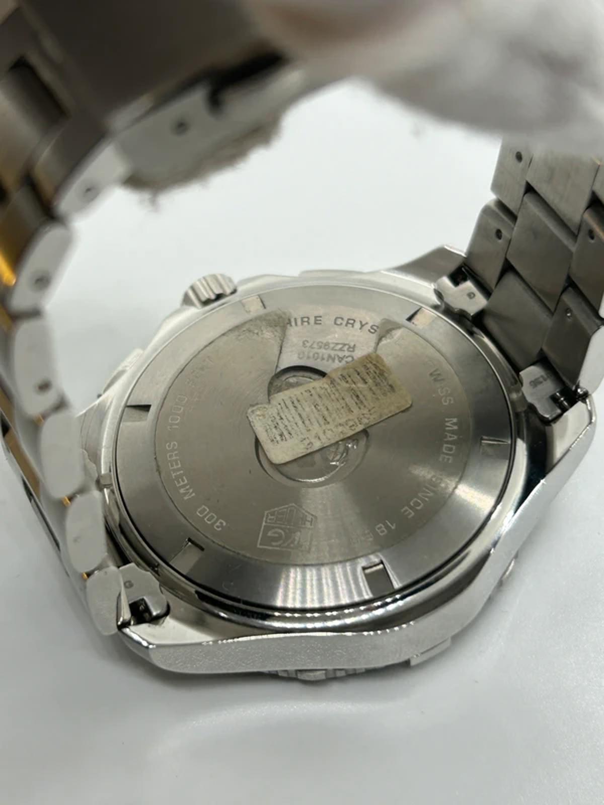 Tag Heuer watch Can1010 aquaracer box and booklet in very good condition
