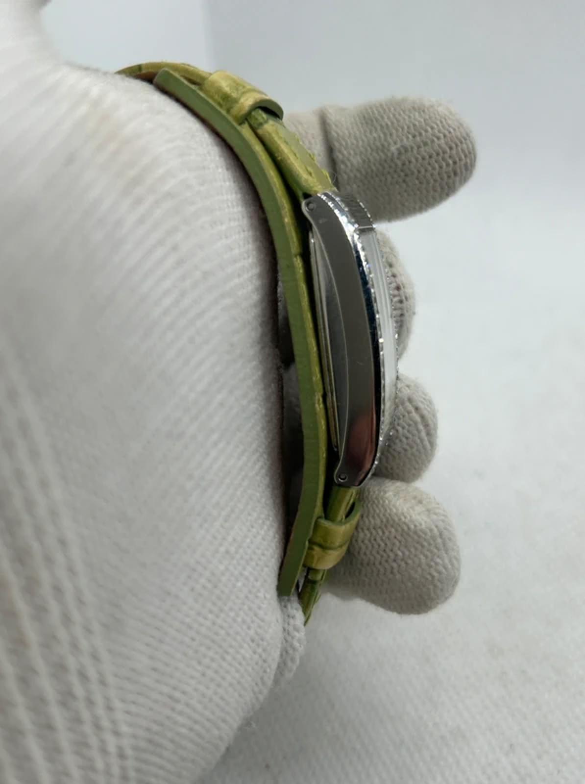 Ladies Fossil silver case watch with olive green strap with watch tin