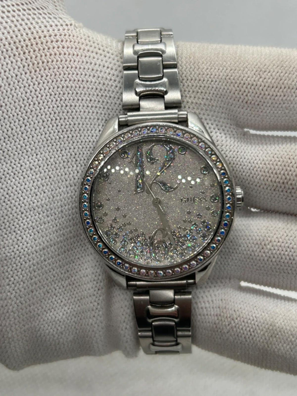 Ladies silver Guess watch diamanté bezel with silver dial and silver bracelet