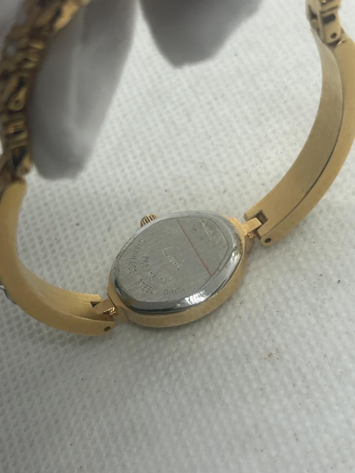 Ladies limit gold cocktail dress watch silver dial with box and papers