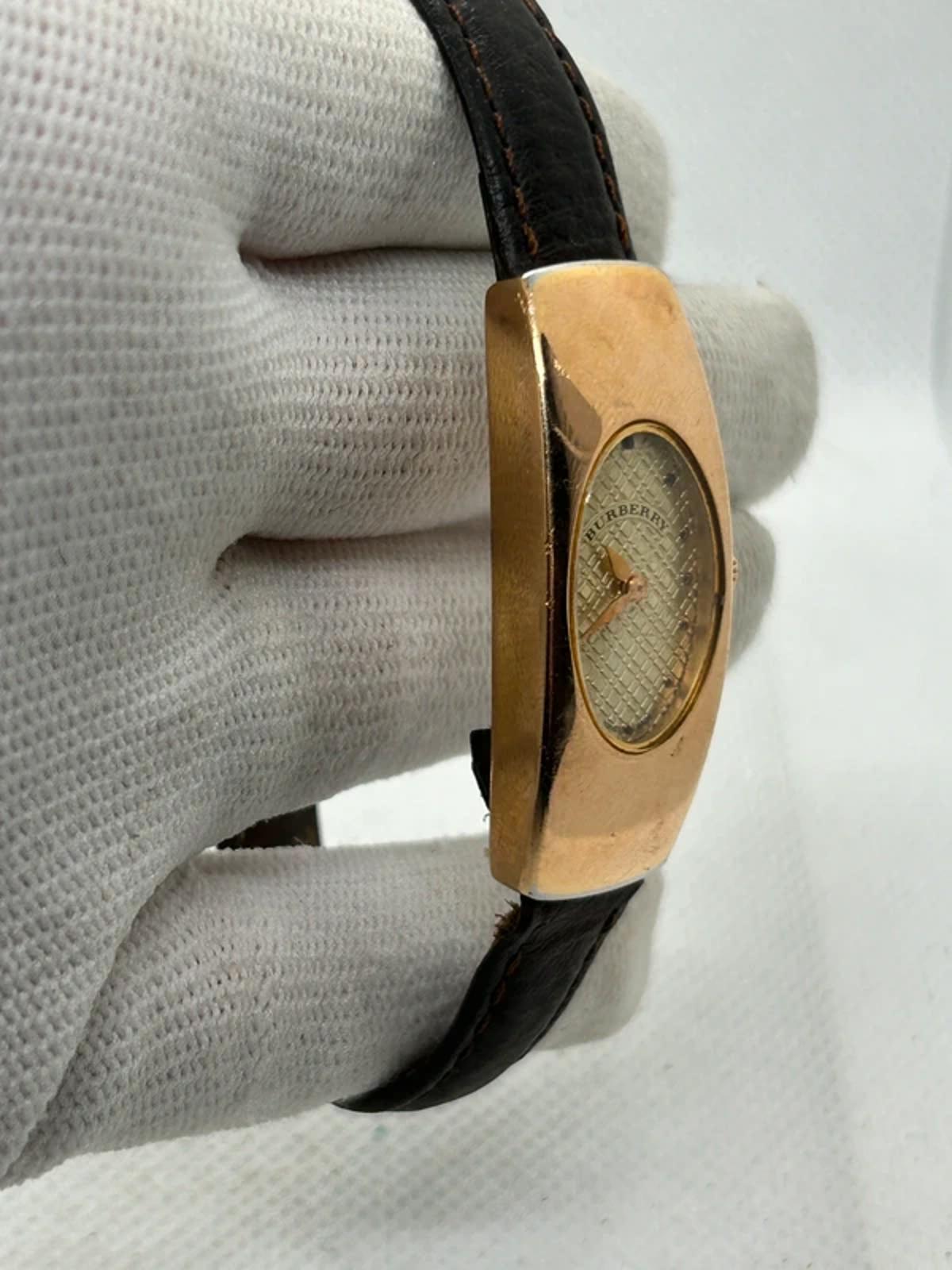 Ladies Burberry watch rose gold case with pattern dial and broken brown strap