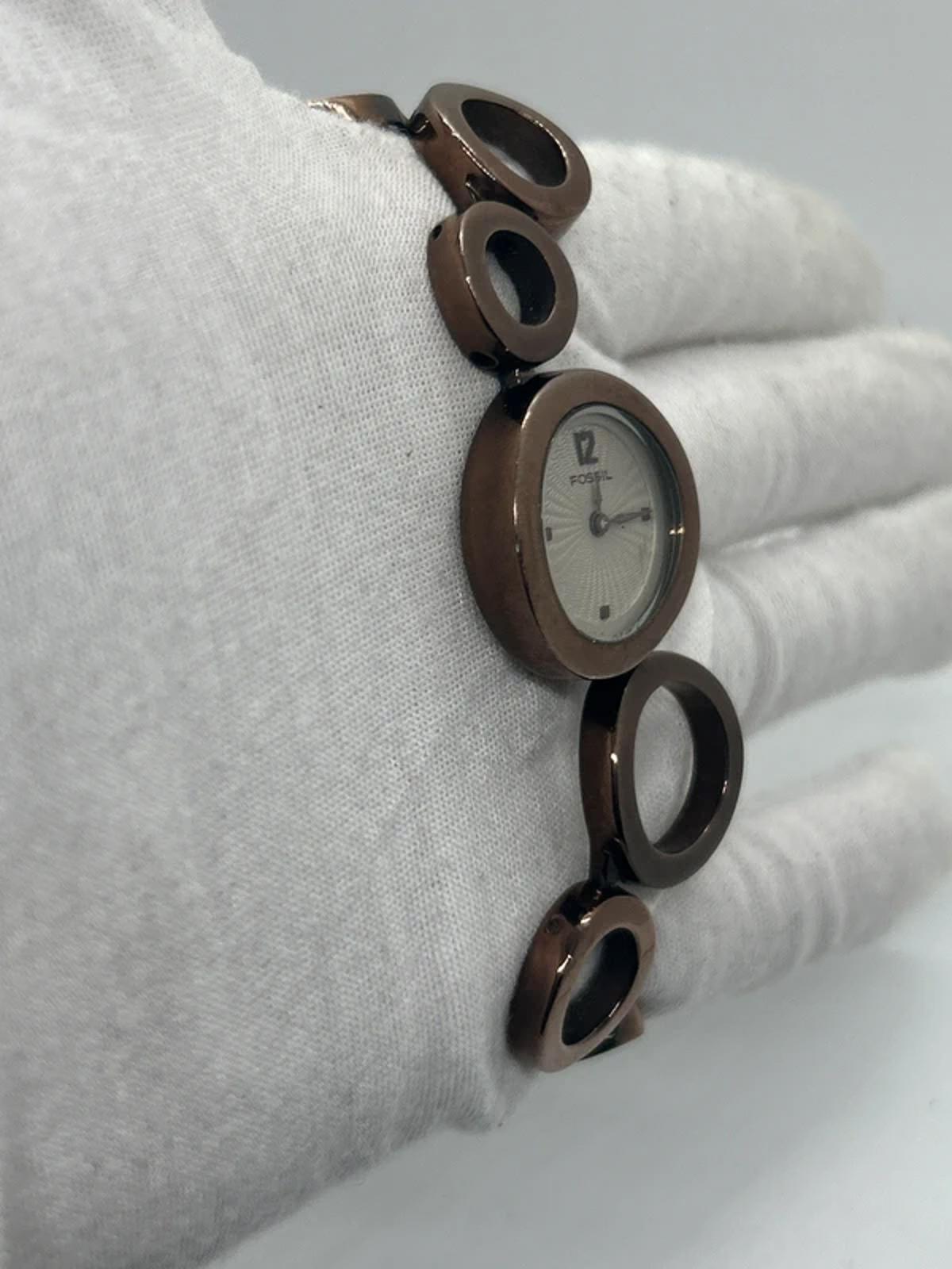Ladies Fossil bronze bracelet watch waved dial