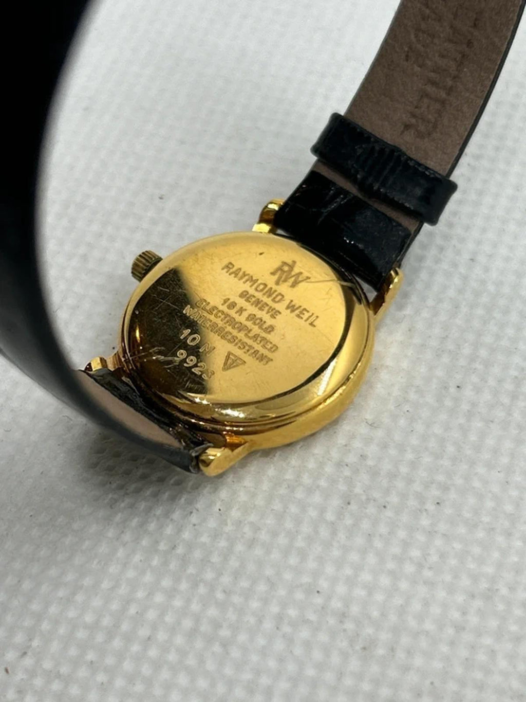 Raymond Weil 18k electro gold plated watch with white dial and black strap