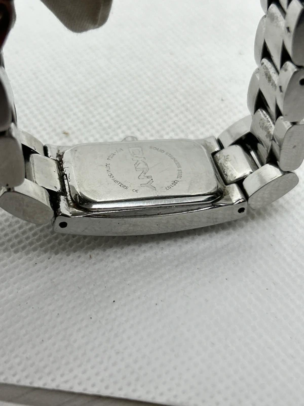 Ladies DKNY slim size silver watch with white dial and silver bracelet