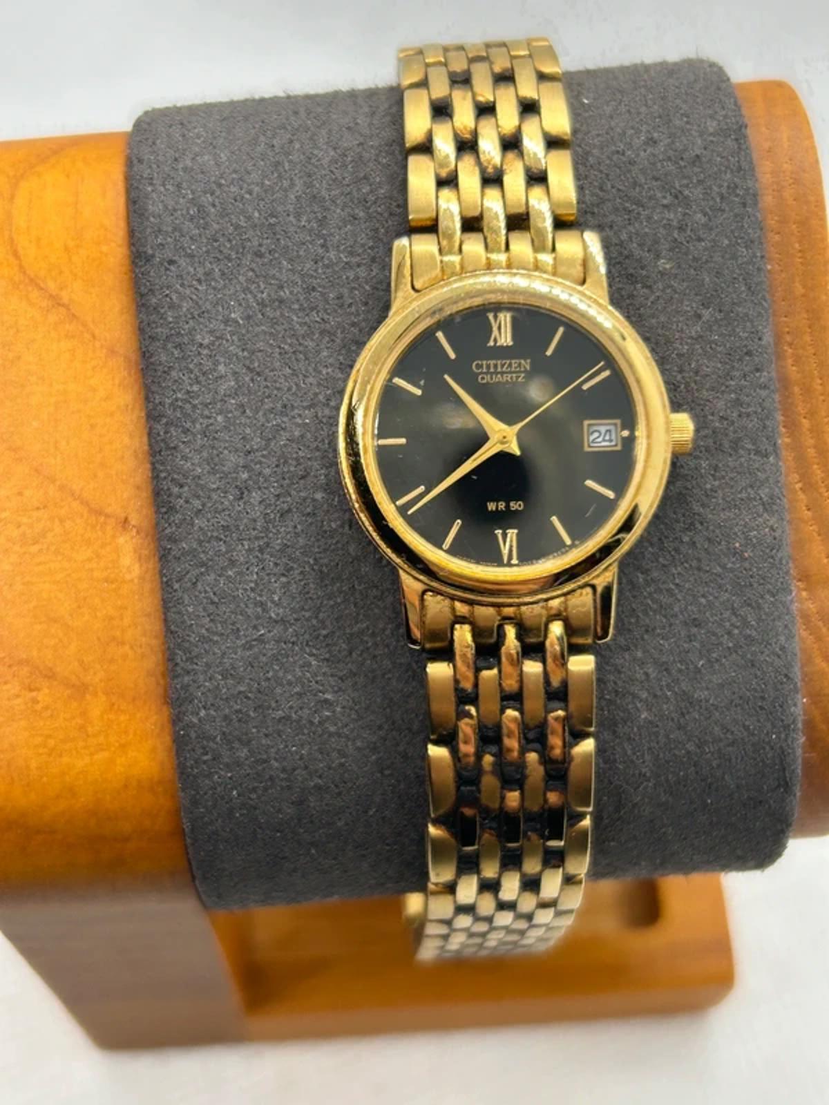 Ladies Citizen gold quartz detach with black dial dress watch