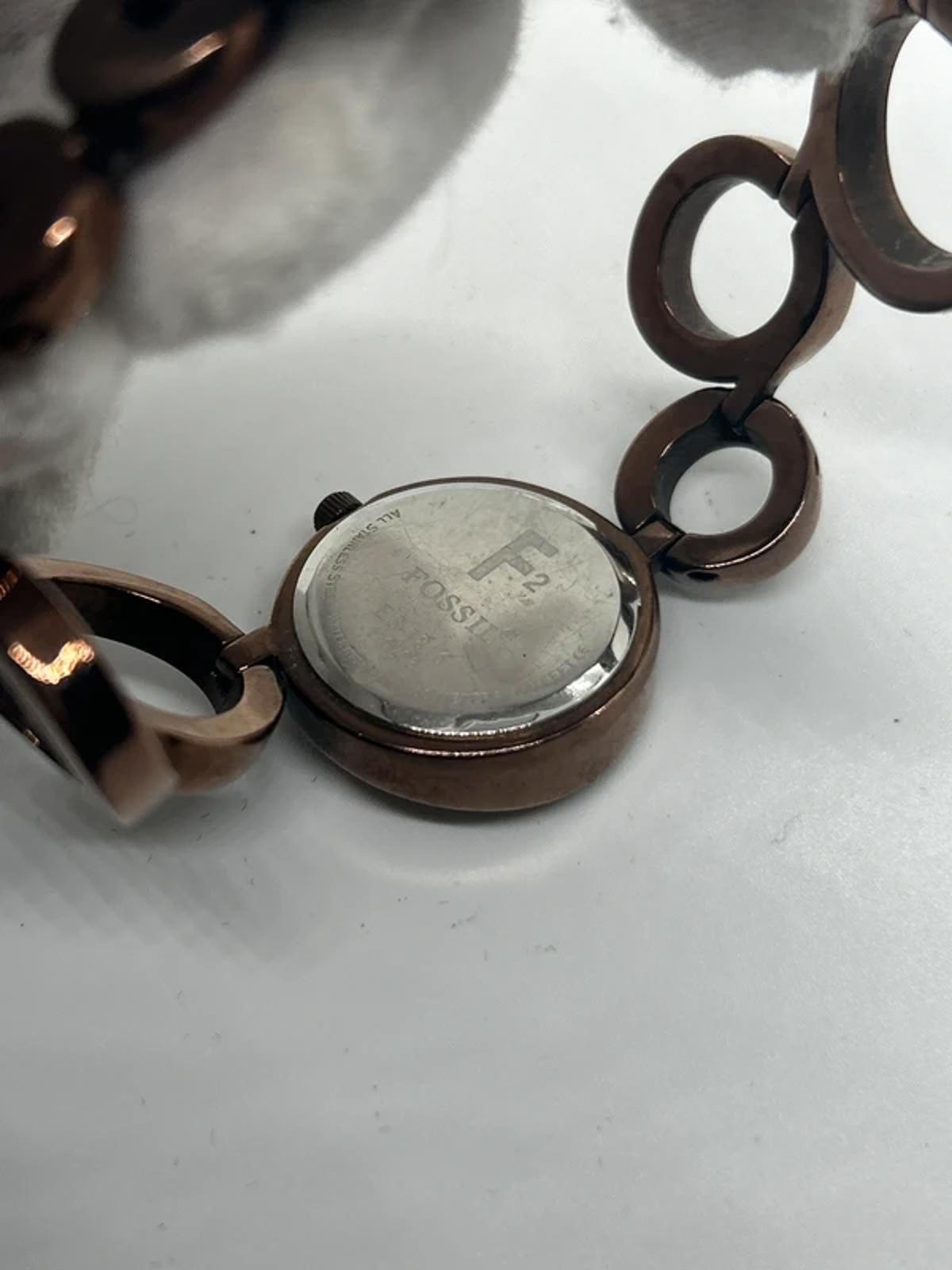 Ladies Fossil bronze bracelet watch waved dial