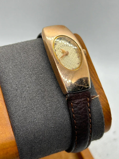 Ladies Burberry watch rose gold case with pattern dial and broken brown strap