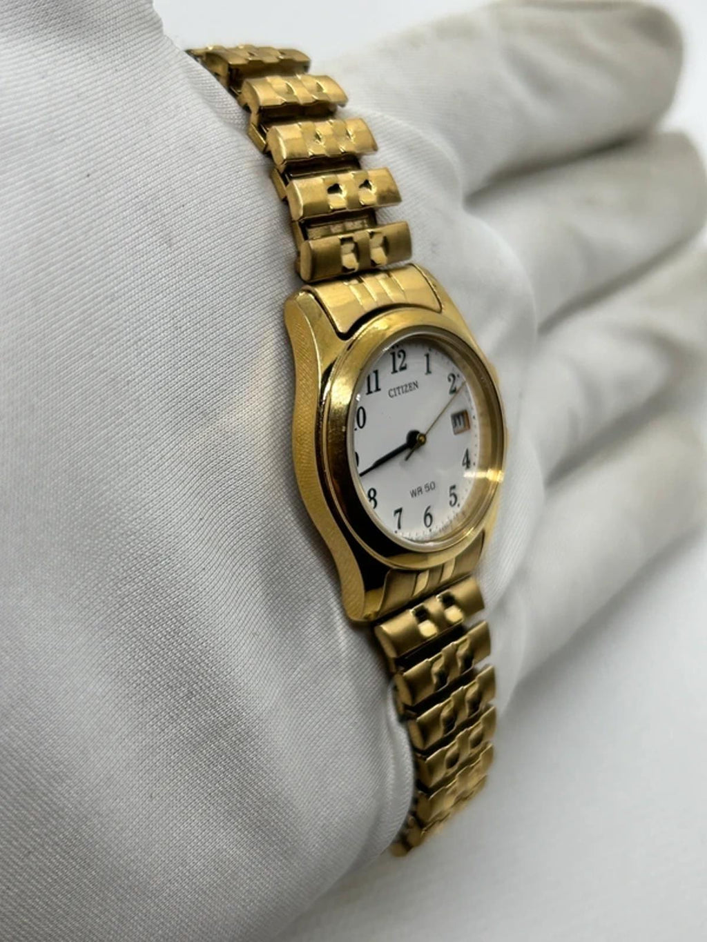 Ladies gold Citizen Watch stretch gold bracelet with white dial