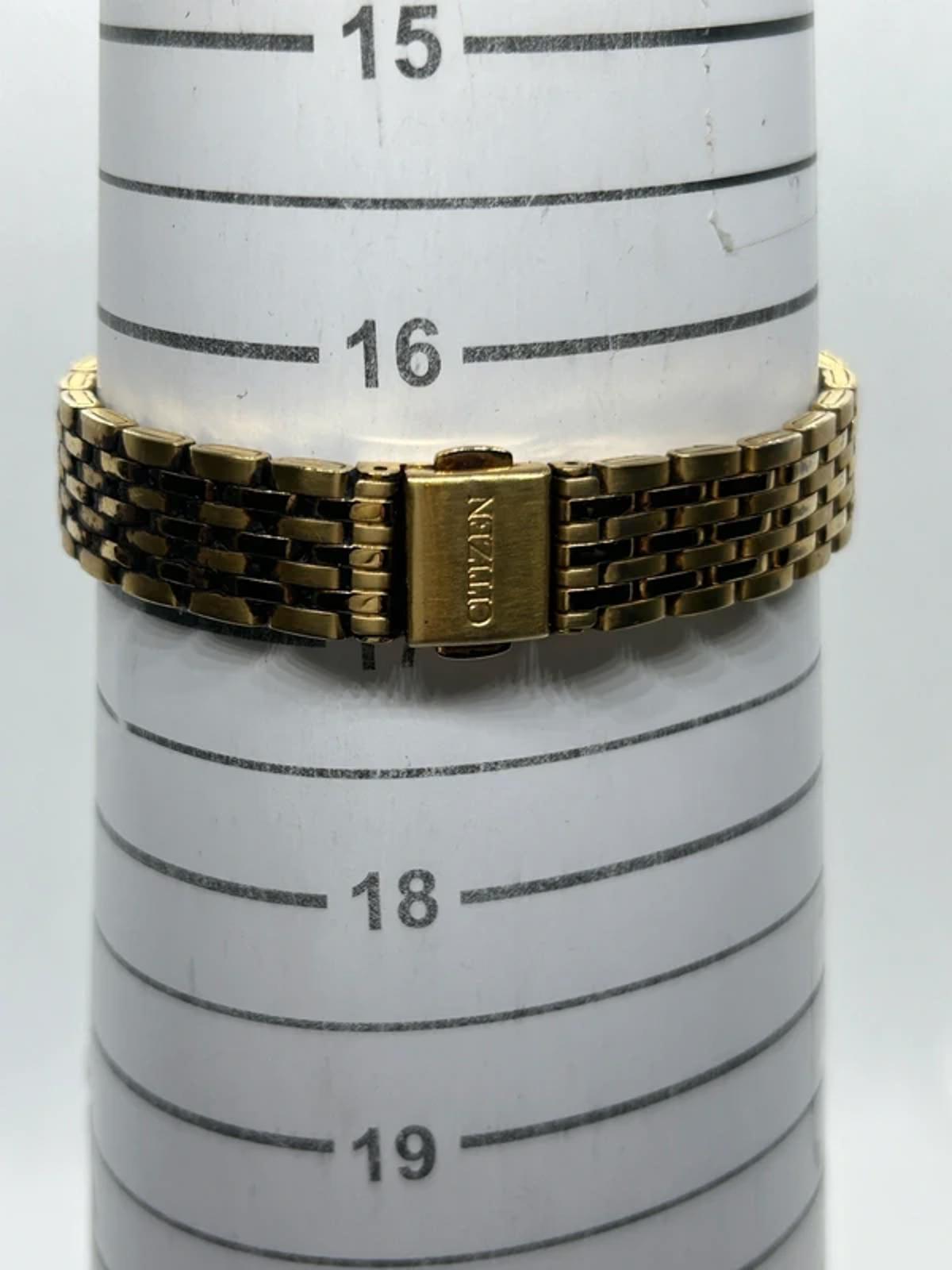 Ladies Citizen gold quartz detach with black dial dress watch