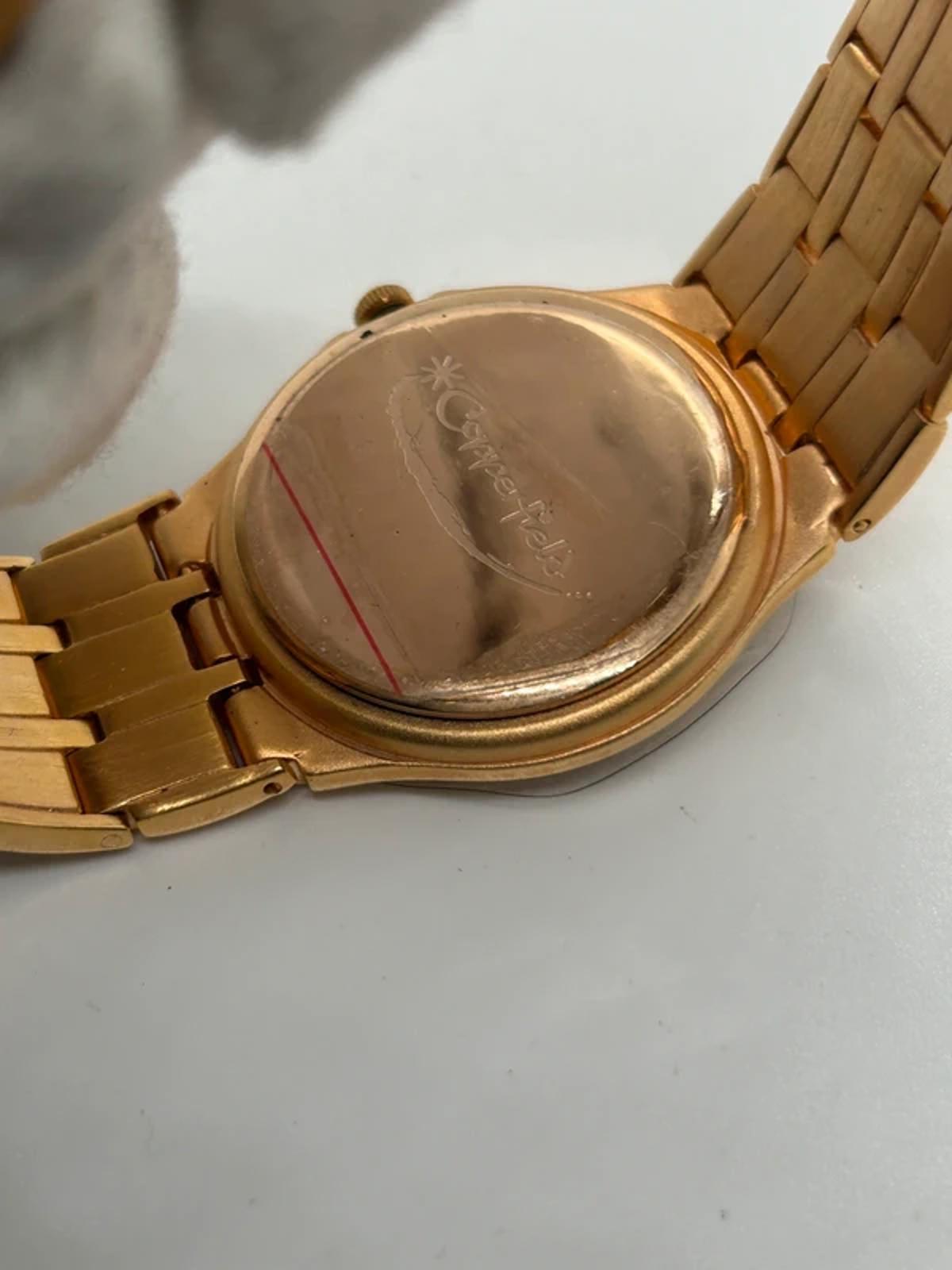 Ladies Copperfield gold case watch and bracket with white dial