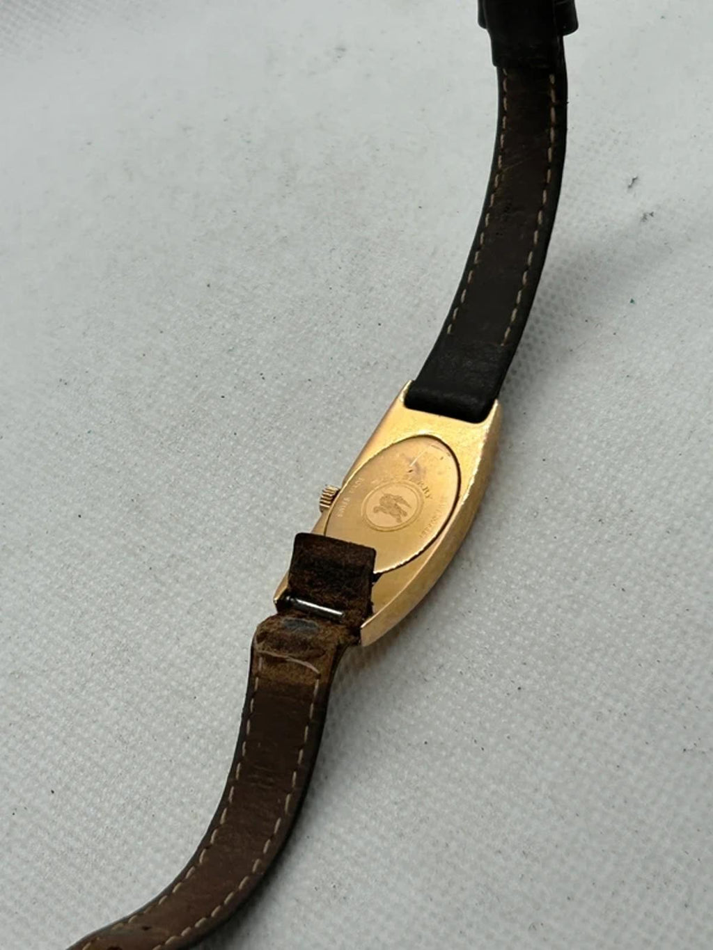 Ladies Burberry watch rose gold case with pattern dial and broken brown strap
