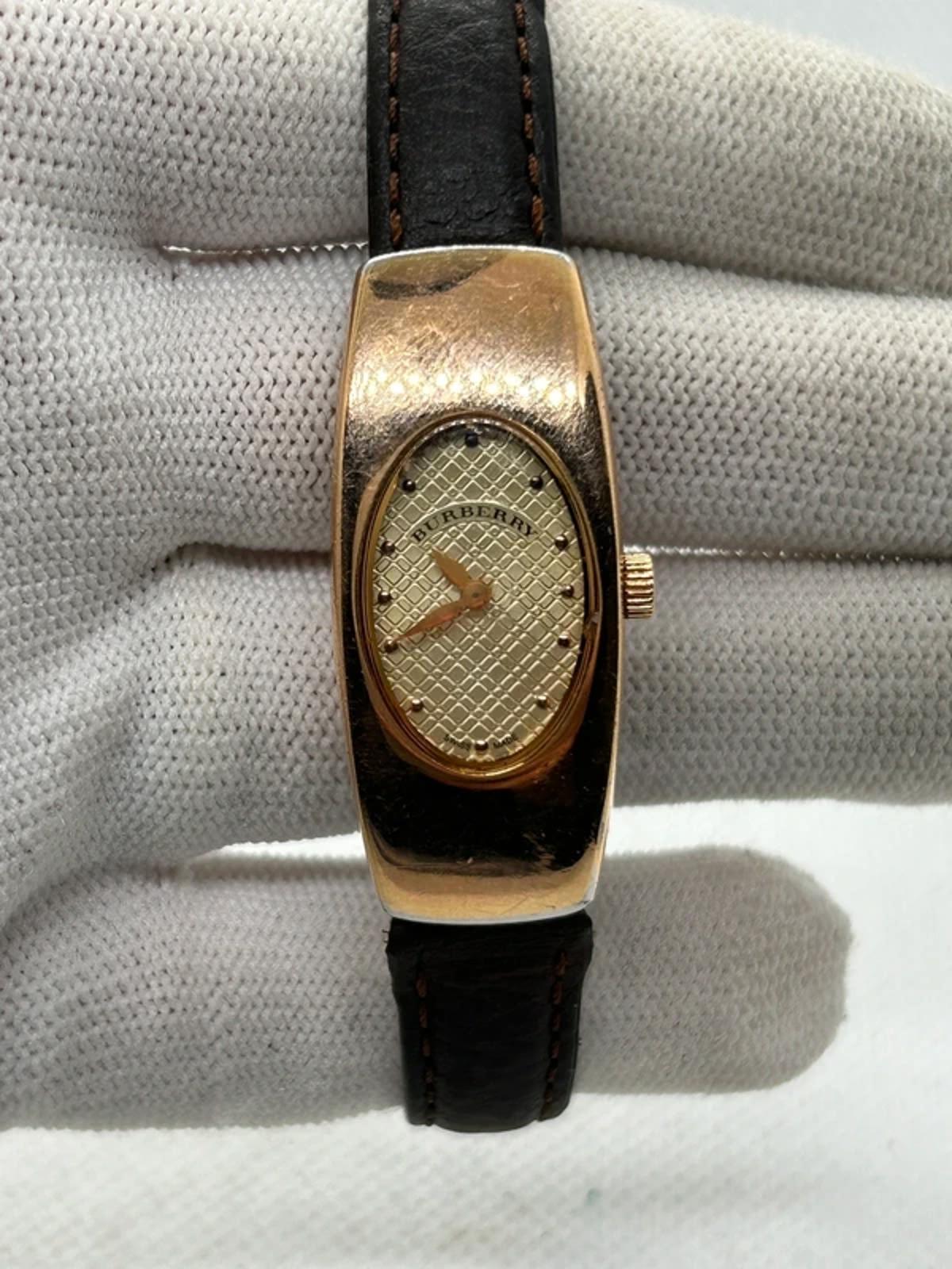 Ladies Burberry watch rose gold case with pattern dial and broken brown strap